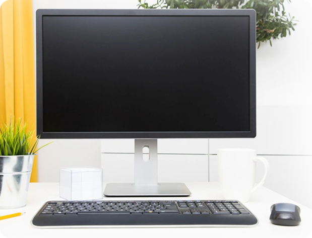 A computer setup on a table with white background