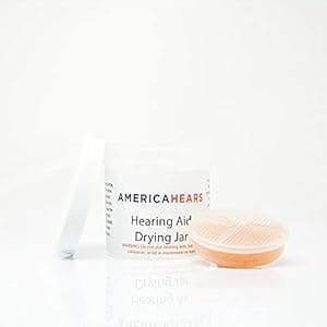 A jar of hearing aid drying jar next to a container.