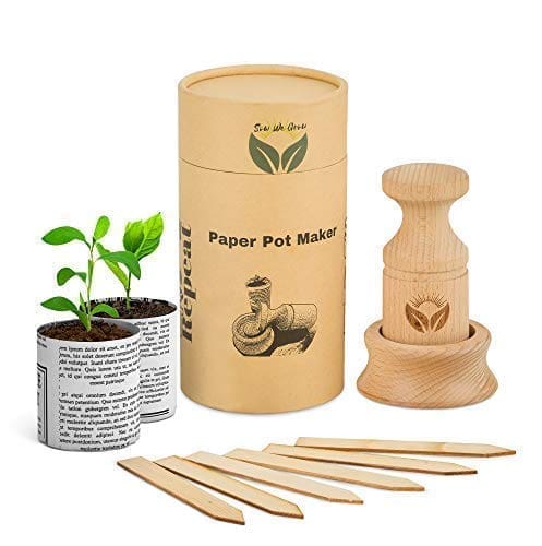 A wooden pot holder and plant markers in a box.