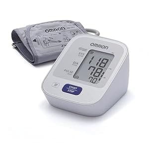 A white and silver blood pressure monitor next to a gray bag.