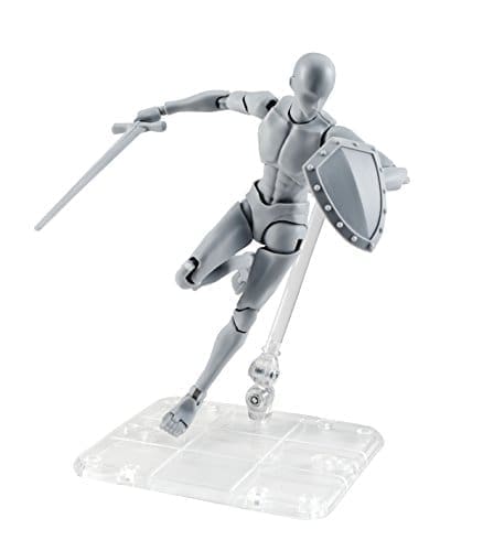 A gray figurine is holding a sword and shield.