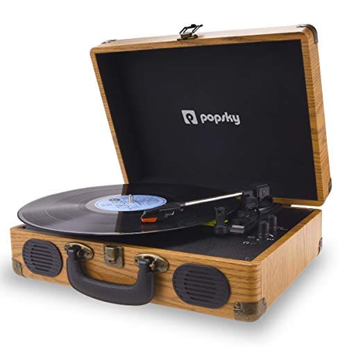 A record player that is sitting in a wooden case.