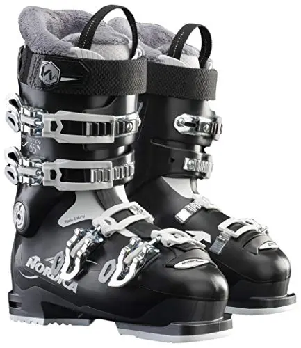 A pair of black ski boots with white trim.