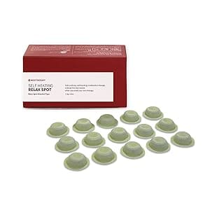 A box of 1 2 round green contact lenses.