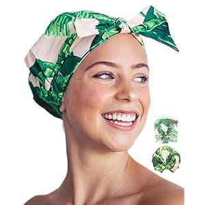 A woman with a green and white head wrap on.