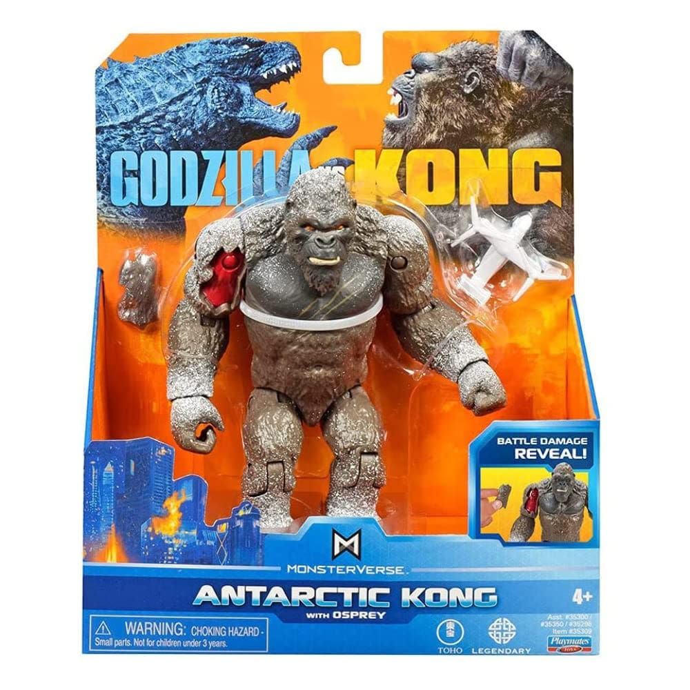 A toy godzilla is in the box and has a white background.