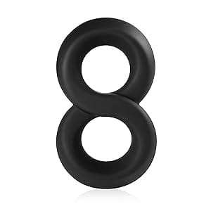 A number eight shaped rubber ring sitting on top of a white surface.