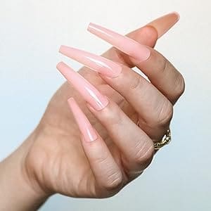 A woman 's hand with long pink nails.