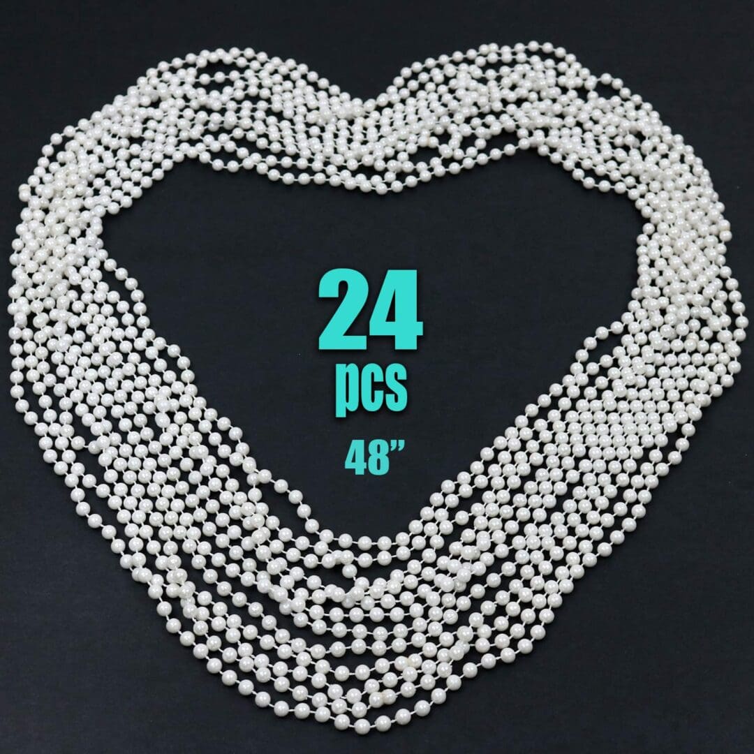 A heart shaped necklace with the number " 2 4 " written on it.