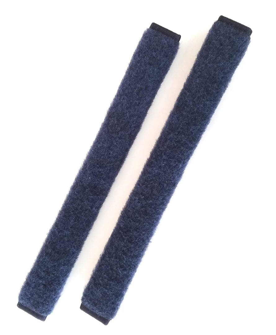 A pair of blue velcro straps on white background.