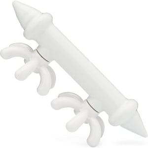 A white plastic toy with two arms and legs.